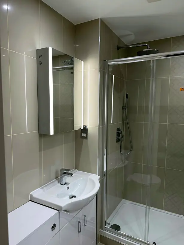 Complete bathroom with vanity unit, LED mirror cabinet and shower enclosure